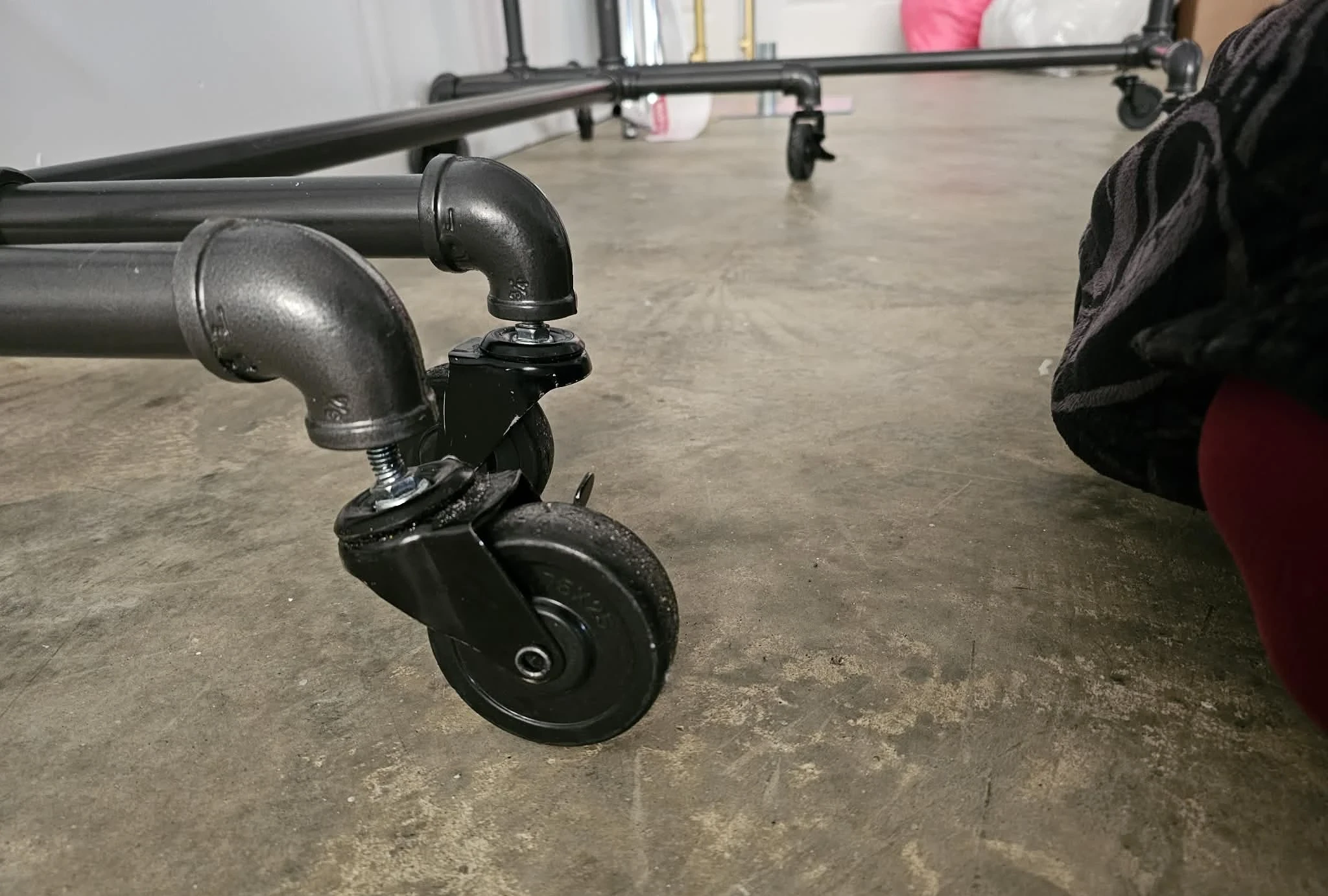 Broken caster on pipe rack base