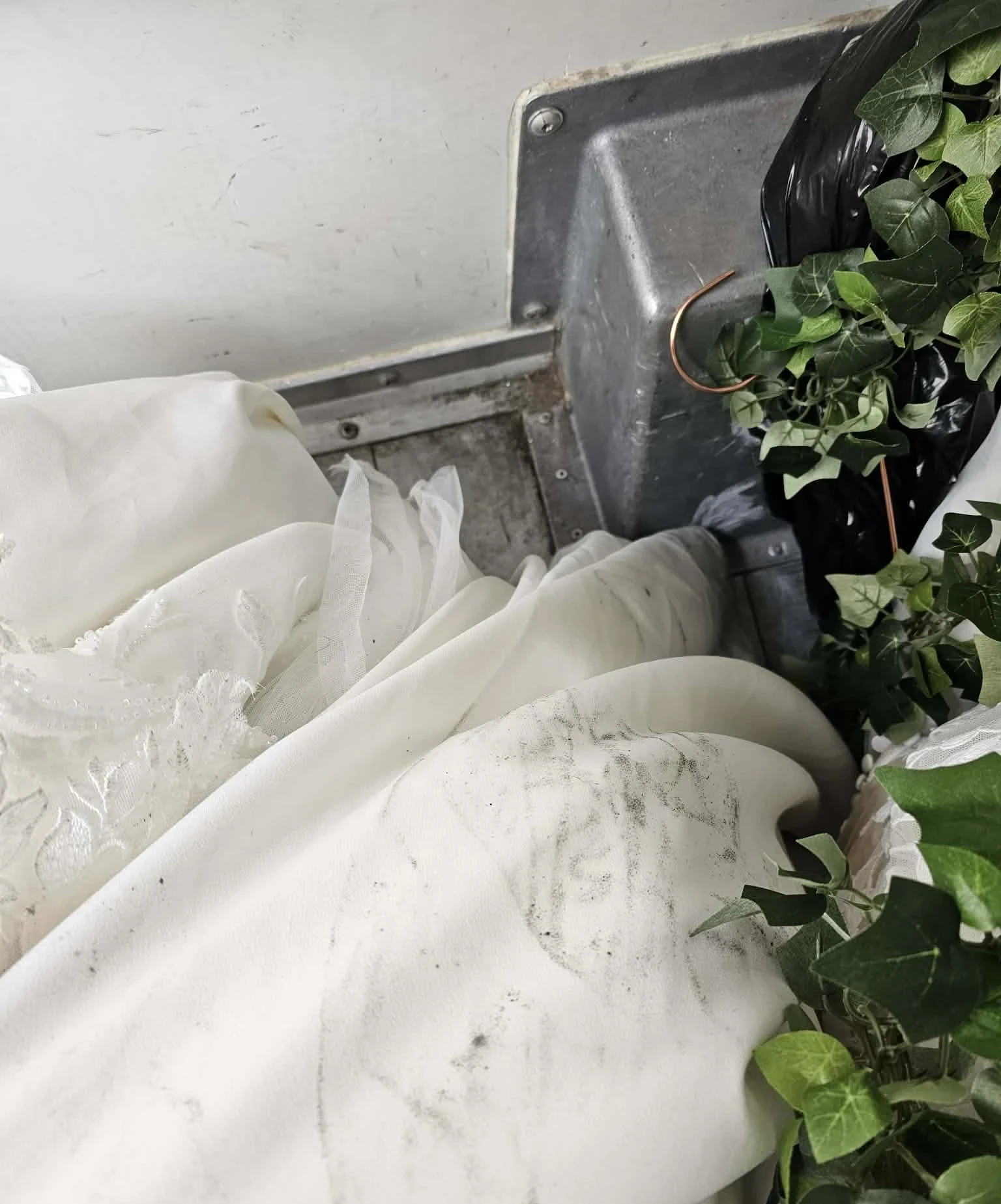 Gown fabric with grease marks near greenery