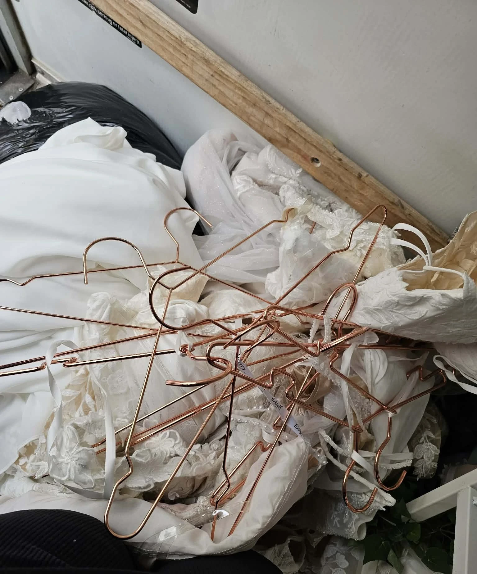 Mass of copper hangers on gowns