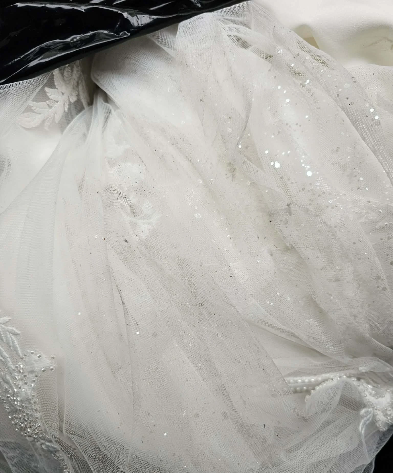 Soiled tulle with dirt spots