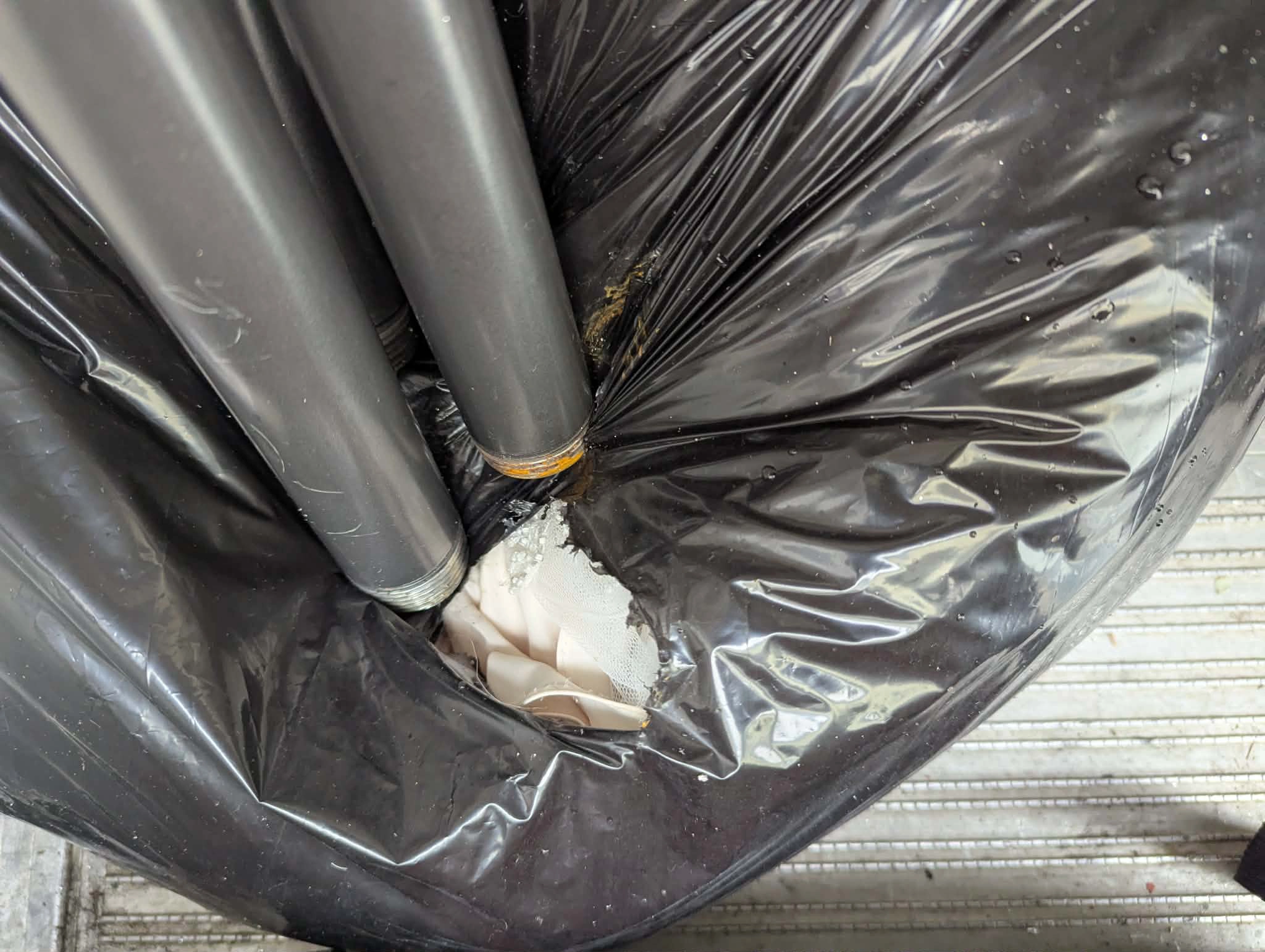 Broken display piece in trash bag