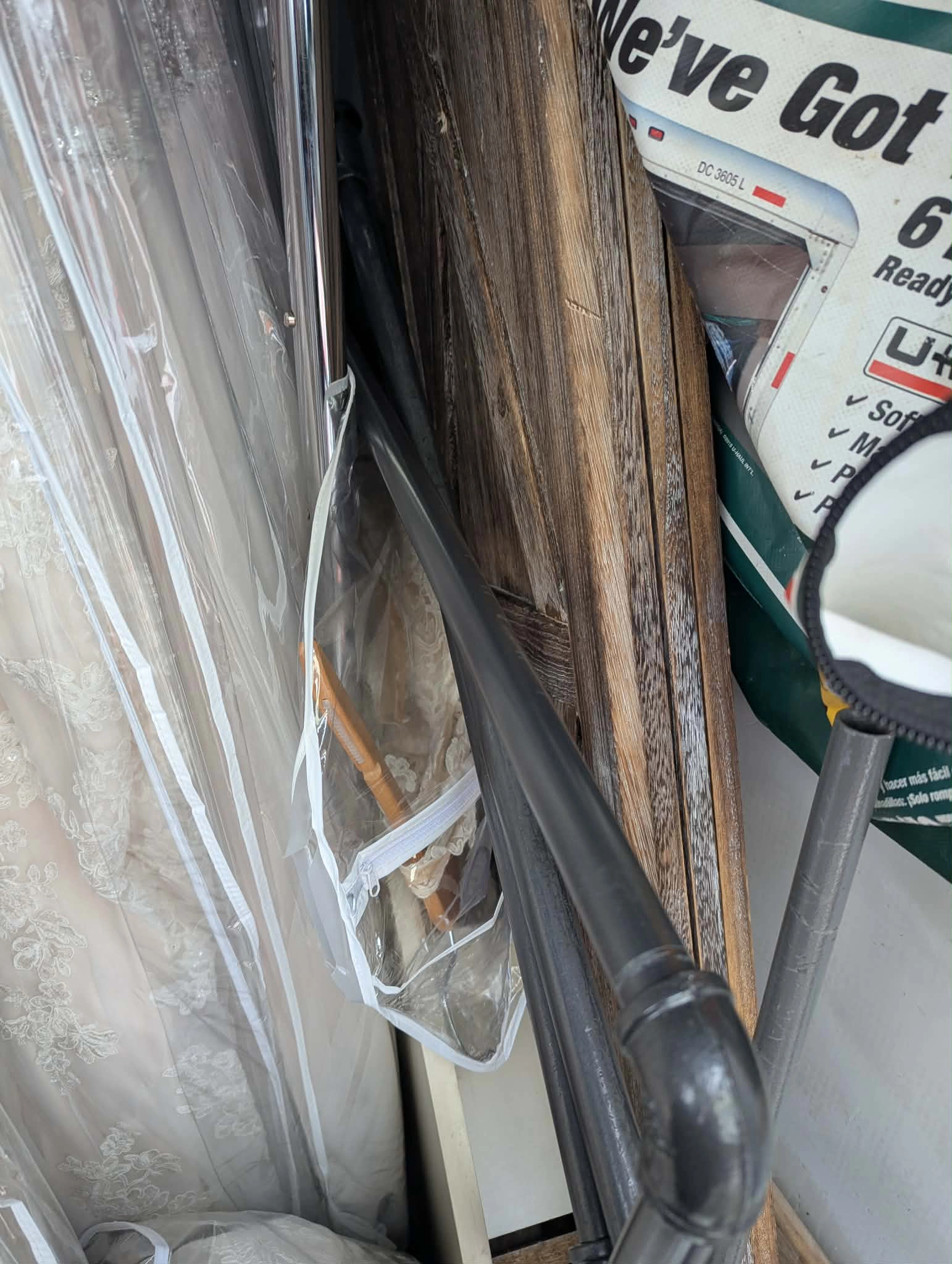 Wood display and pipe rack pressed together in truck