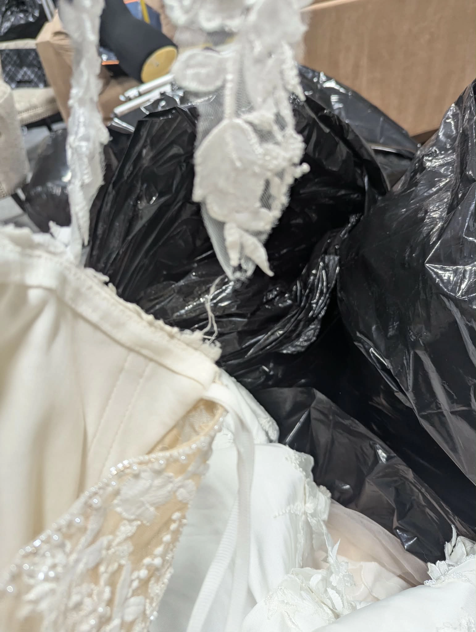 Gowns crammed with trash bags in truck